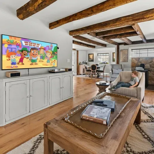 Open living room (with sleeper sofa), kitchen and dining area. Flat screen smart Roku TV, central heat/AC, strong WiFi throughout, the woodstove is inoperable and not to be used.