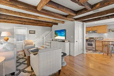 Open living room (with sleeper sofa), kitchen and dining area. Flat screen smart Roku TV, central heat/AC, strong WiFi throughout, the woodstove is inoperable and not to be used.