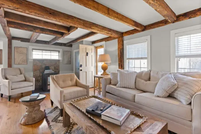 Open living room (with sleeper sofa), kitchen and dining area. Flat screen smart Roku TV, central heat/AC, strong WiFi throughout, the woodstove is inoperable and not to be used.