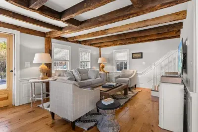 Open living room (with sleeper sofa), kitchen and dining area. Flat screen smart Roku TV, central heat/AC, strong WiFi throughout, the woodstove is inoperable and not to be used.
