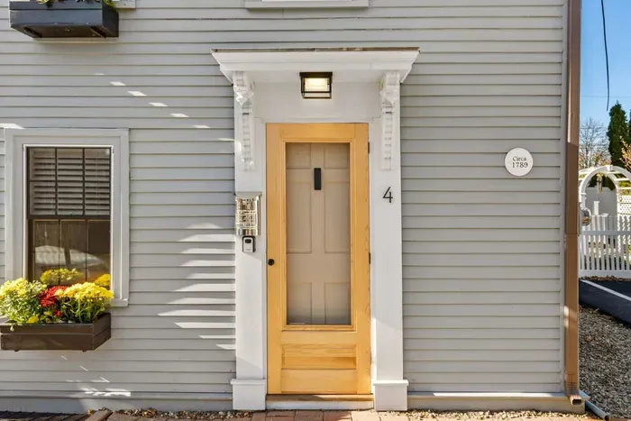 Front entrance. You have 1 off-street parking spots to the right of the property.