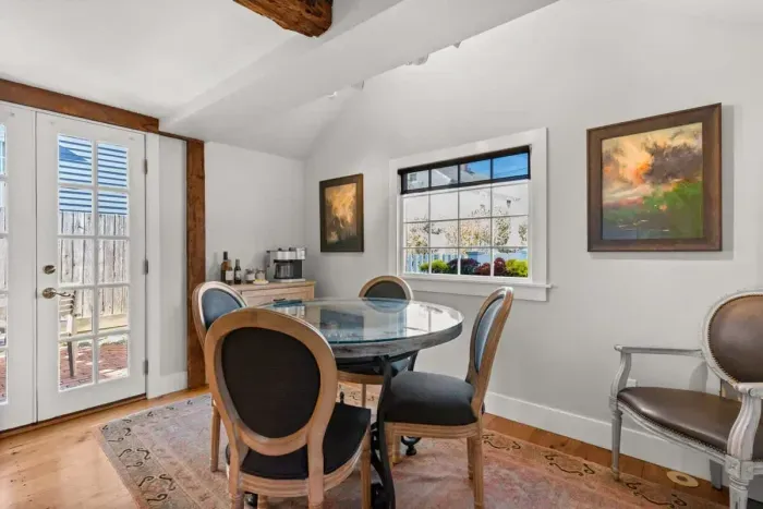 Dining area, just off the kitchen, with double doors leading out to the private quaint back patio.