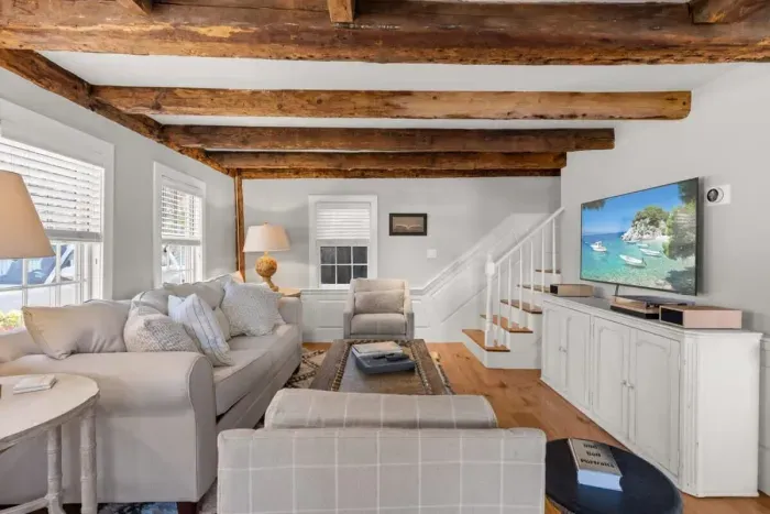 Open living room (with sleeper sofa), kitchen and dining area. Flat screen smart Roku TV, central heat/AC, strong WiFi throughout, the woodstove is inoperable and not to be used.