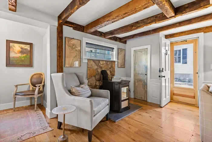 Open living room (with sleeper sofa), kitchen and dining area. Flat screen smart Roku TV, central heat/AC, strong WiFi throughout, the woodstove is inoperable and not to be used.