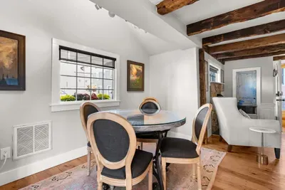 Dining area, just off the kitchen, with double doors leading out to the private quaint back patio.