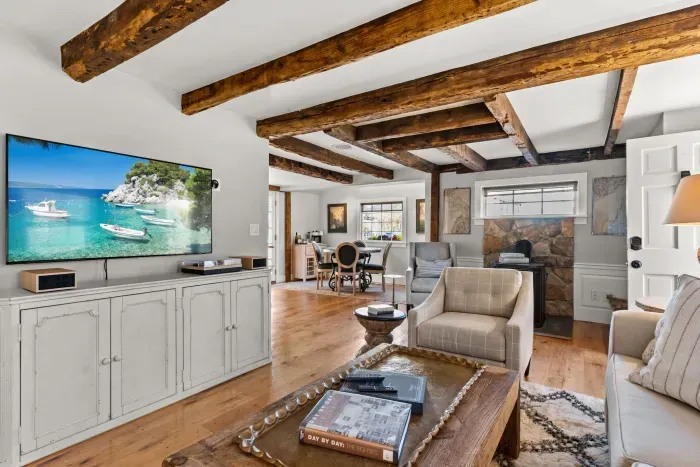 Open living room (with sleeper sofa), kitchen and dining area. Flat screen smart Roku TV, central heat/AC, strong WiFi throughout, the woodstove is inoperable and not to be used.