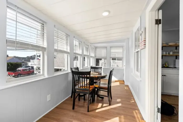 Top unit: Three-seasons porch with futon and table