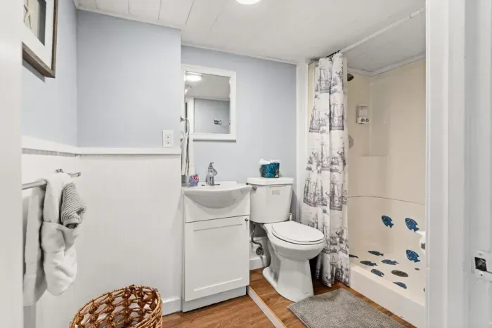 Bottom unit: Full bathroom with stand up shower.