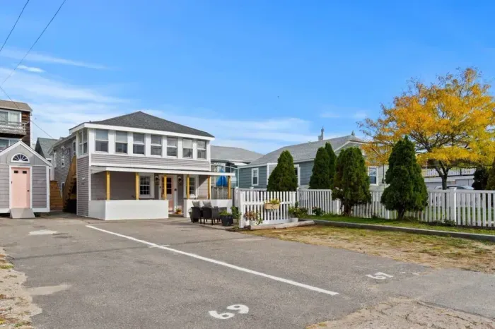 View of property from Railroad Ave. This is a two-family property, with a 2 bedroom 1 bathroom on the ground level, and 2 bedroom 1 bathroom on the second level.