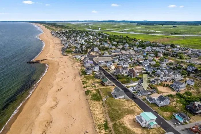 Aerial view, across the street from the beach, large private deck, walking to all the bars & restaurants including the Sunset Club, Riptide Cafe, and The Cottage Creamery!