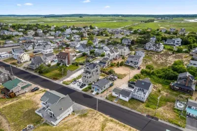 Aerial view, across the street from the beach, large private deck, walking to all the bars & restaurants including the Sunset Club, Riptide Cafe, and The Cottage Creamery!