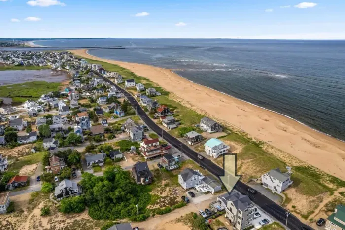 Aerial view, across the street from the beach, large private deck, walking to all the bars & restaurants including the Sunset Club, Riptide Cafe, and The Cottage Creamery!