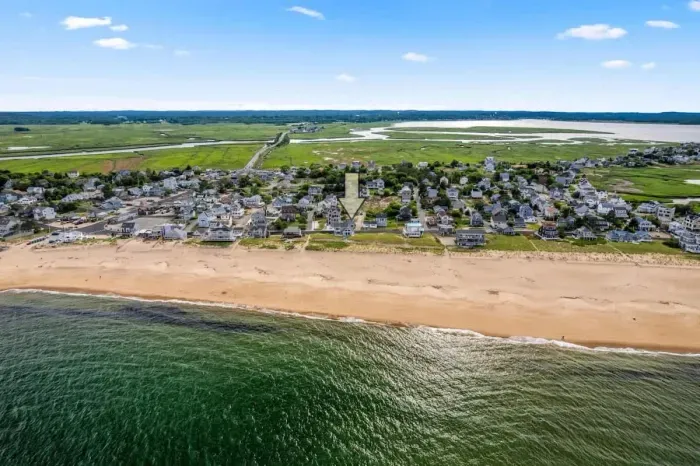 Aerial view, across the street from the beach, large private deck, walking to all the bars & restaurants including the Sunset Club, Riptide Cafe, and The Cottage Creamery!