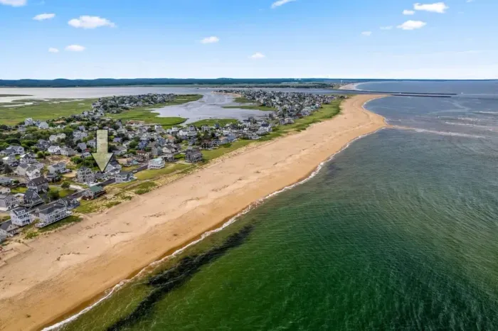 Aerial view, across the street from the beach, large private deck, walking to all the bars & restaurants including the Sunset Club, Riptide Cafe, and The Cottage Creamery!