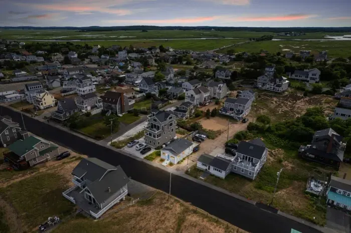 Aerial view, across the street from the beach, large private deck, walking to all the bars & restaurants including the Sunset Club, Riptide Cafe, and The Cottage Creamery!