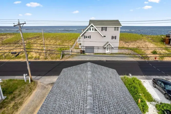 Aerial view, across the street from the beach, large private deck, walking to all the bars & restaurants including the Sunset Club, Riptide Cafe, and The Cottage Creamery!