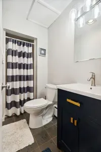 1st floor full bathroom with a standing shower