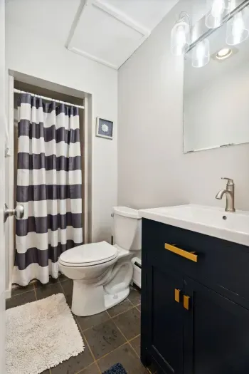 1st floor full bathroom with a standing shower