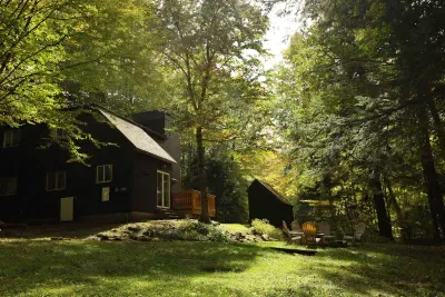 A backyard view of the home and the yard