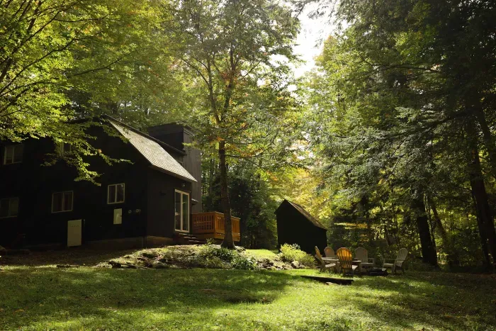 A backyard view of the home and the yard