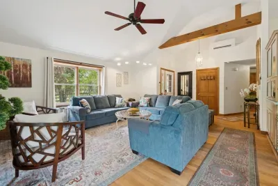 The living area with plenty of seating for everyone, a Queen pullout sofa, and a smart tv!