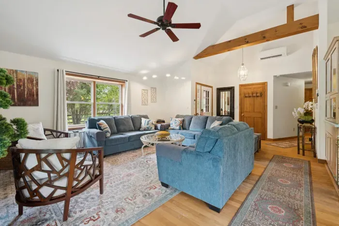 The living area with plenty of seating for everyone, a Queen pullout sofa, and a smart tv!