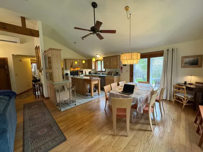 The dining area has plenty of seating for all guests. This open concept living space is perfect for holiday meals!