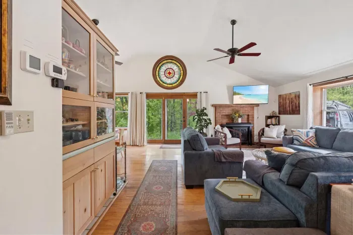 The living area with plenty of seating for everyone, a Queen pullout sofa, and a smart tv!