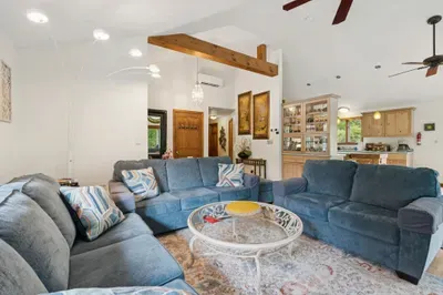 The living area with plenty of seating for everyone, a Queen pullout sofa, and a smart tv!