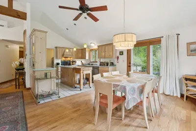 The dining area has plenty of seating for all guests. This open concept living space is perfect for holiday meals!