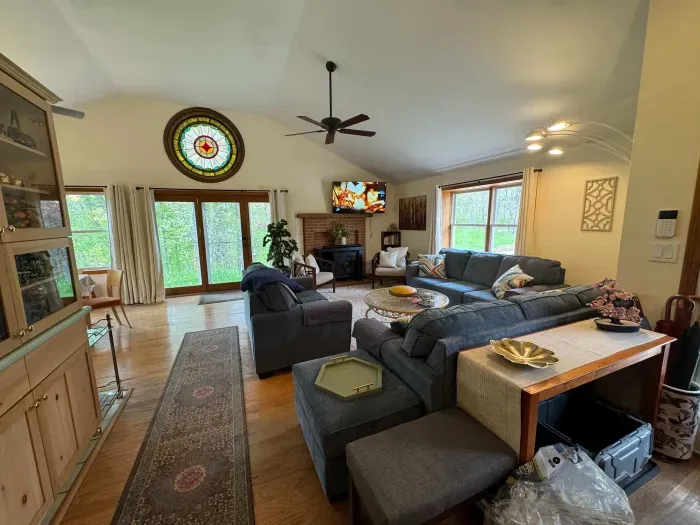 The living area with plenty of seating for everyone, a Queen pullout sofa, and a smart tv!