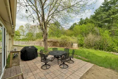 The outdoor patio off of the kitchen with views of the Lamprey River!