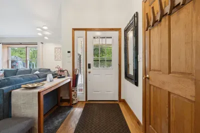 Entryway with storage closet.