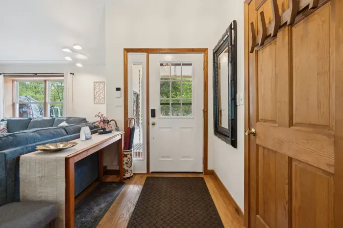Entryway with storage closet.