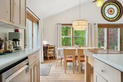 The dining area has plenty of seating for all guests. This open concept living space is perfect for holiday meals!