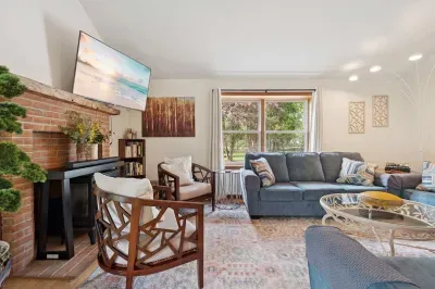 The living area with plenty of seating for everyone, a Queen pullout sofa, and a smart tv!