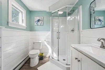 The newly renovated. full bathroom! Standing shower and clean towels provided for all guests