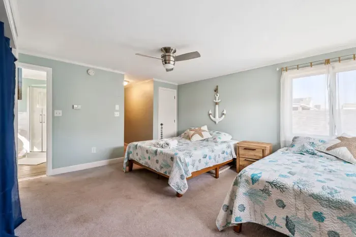 Second bedroom with two full beds. Clean linens provided. The full bathroom en-suite is located in this bedroom.