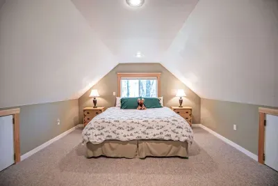 The primary loft bedroom with a king bed! Clean linens and towels provided