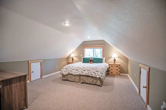 The primary loft bedroom with a king bed! Clean linens and towels provided