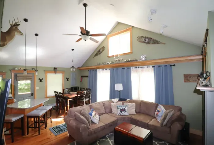Large living room featuring a comfy couch, Smart TV, and gas fireplace