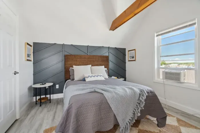 Loft bedroom with queen bed and smart TV
