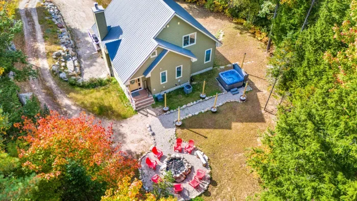 Experience the outdoors with this woods surrounded back yard!