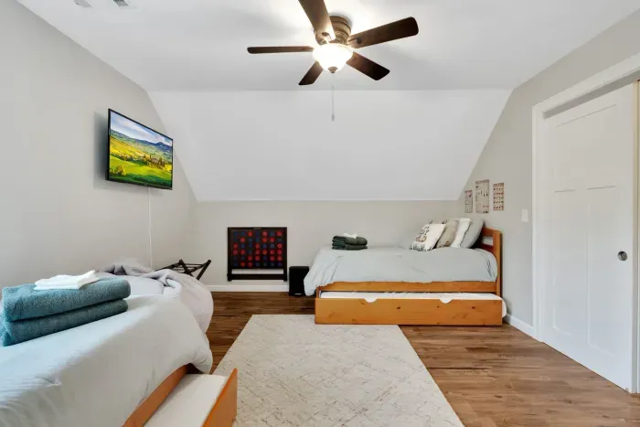 Bedroom #2 with two twin beds, each have a trundle bed. There is a Roku TV in this room and connect four!