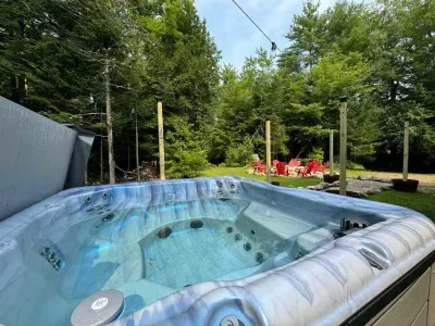 Warm up in the hot tub—a cozy retreat perfect for chilly nights!