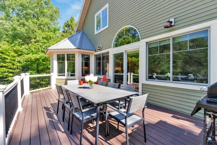 The deck is located off of the family room with seating for 8