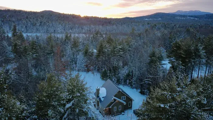 Winter at Mitten Pines Cabin at twilight! Peep the white mountains in the background 
