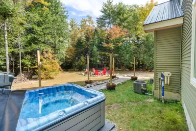 Warm up this winter in the hot tub and gaze under the stars with the string lights—a cozy retreat perfect for chilly nights!