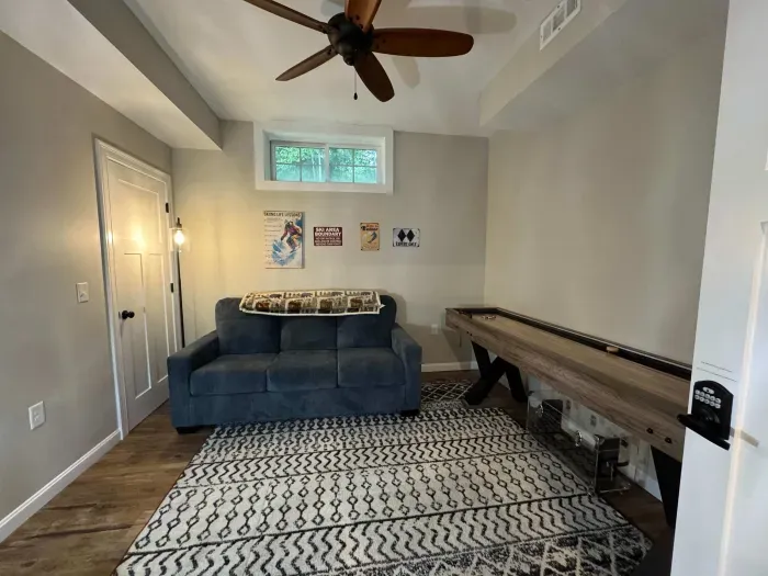 The game room is now in this room! Smart TV with shuffle board!