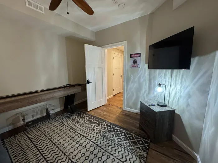 The game room is now in this room! Smart TV with shuffle board!